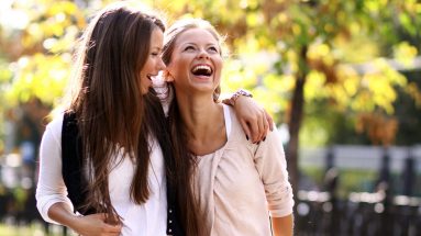 Stock image of two women who are enjoying a walk in the park.